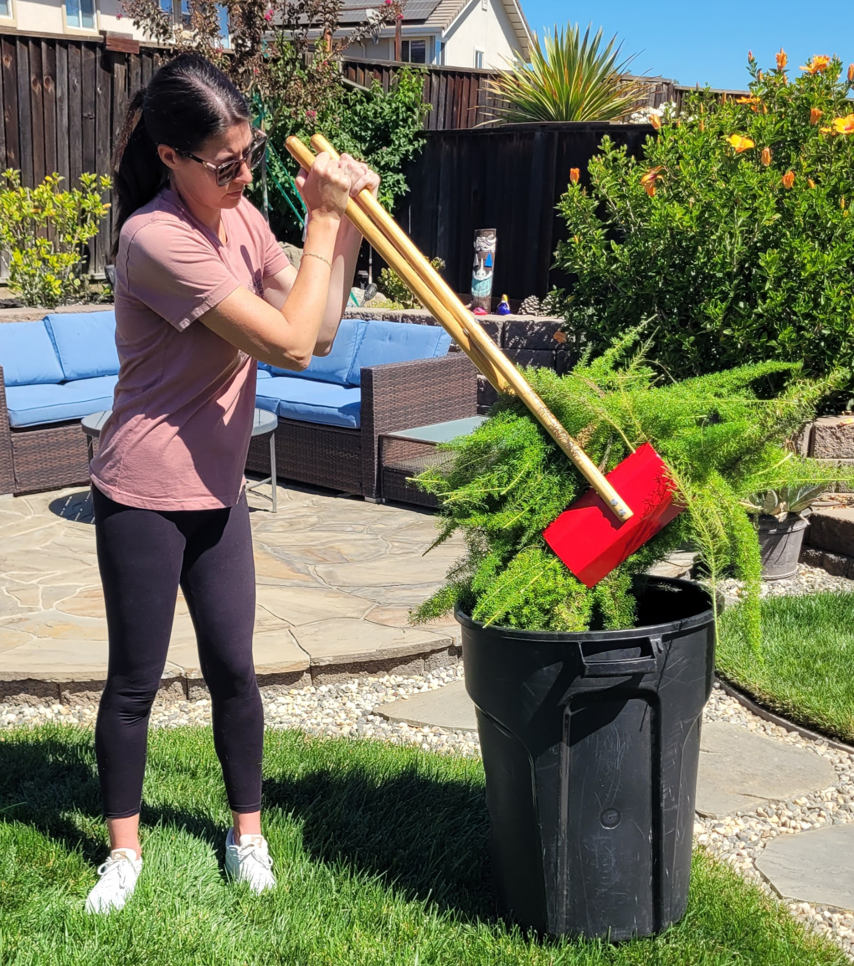 Dumping a load of trimmings into a trash bin with the TerraBOSS